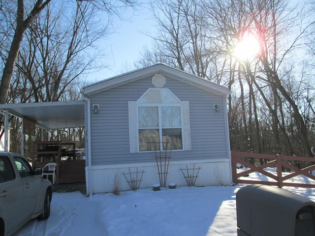276 Robin Ln, Reynoldsburg, OH 43068 - snow covered property featuring a carport