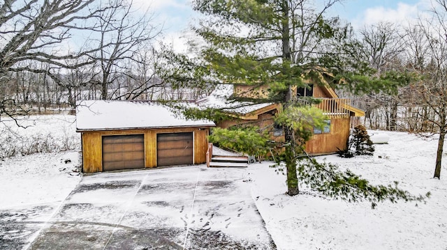 view of snow covered garage