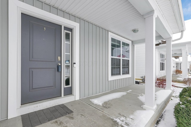 entrance to property featuring covered porch