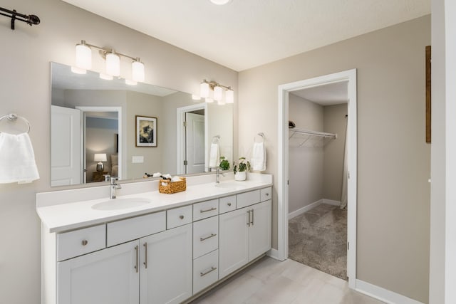 bathroom with a textured ceiling and vanity