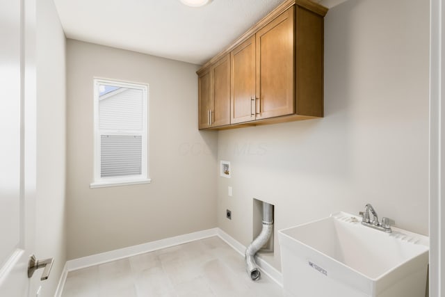 laundry room with cabinets, sink, washer hookup, and hookup for an electric dryer