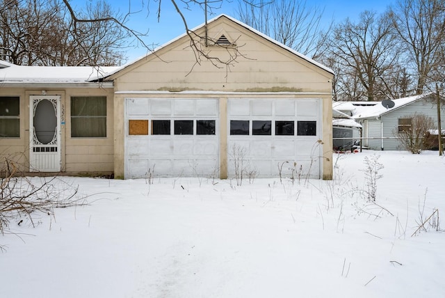 view of snow covered garage