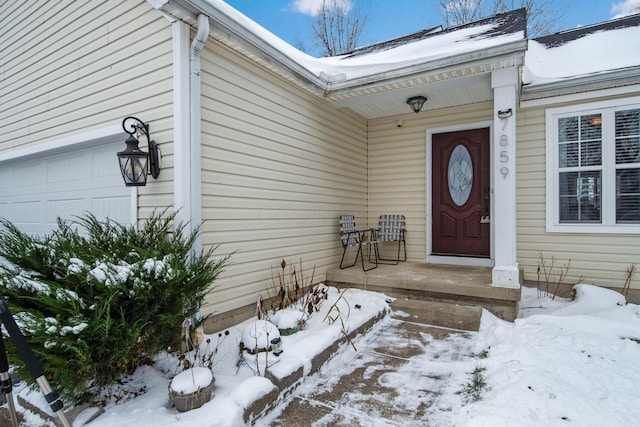 view of snow covered property entrance