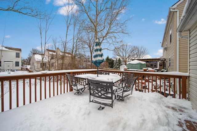 view of snow covered deck