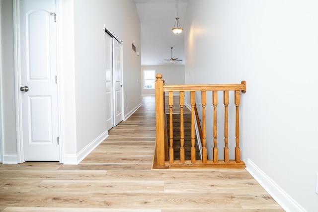 corridor with light wood-type flooring