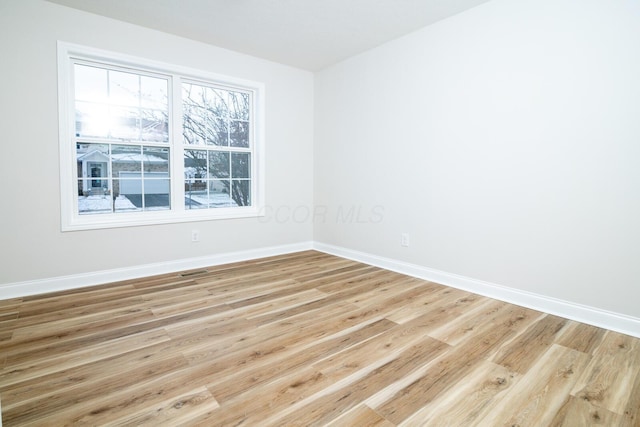 empty room with light wood-type flooring