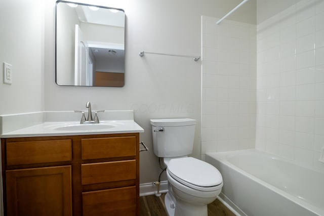 full bathroom with bathtub / shower combination, vanity, and toilet