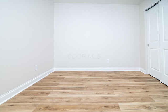 unfurnished room featuring light hardwood / wood-style floors