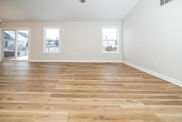 spare room featuring light hardwood / wood-style floors