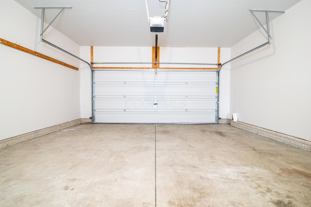 garage featuring a garage door opener