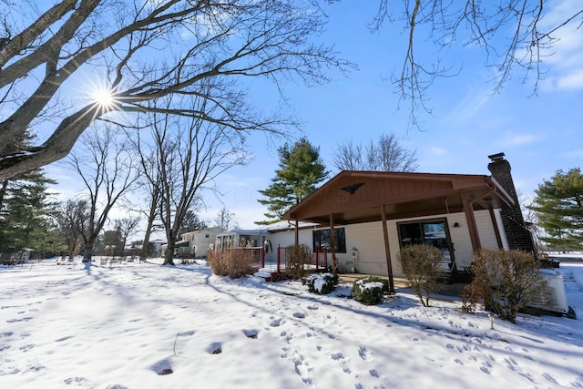 view of yard layered in snow