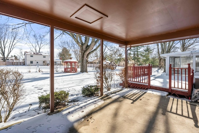 view of snow covered deck