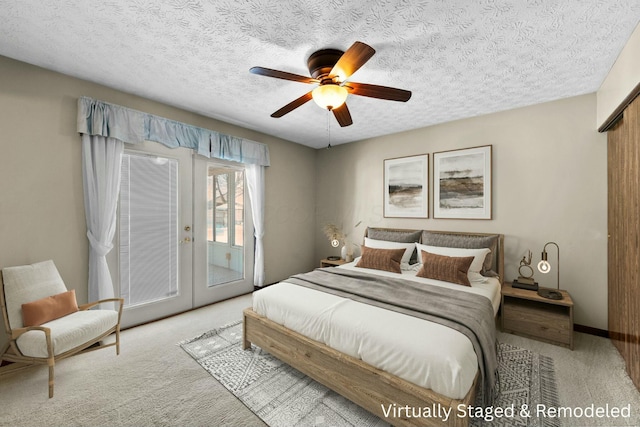 bedroom featuring a textured ceiling, light carpet, french doors, access to outside, and ceiling fan