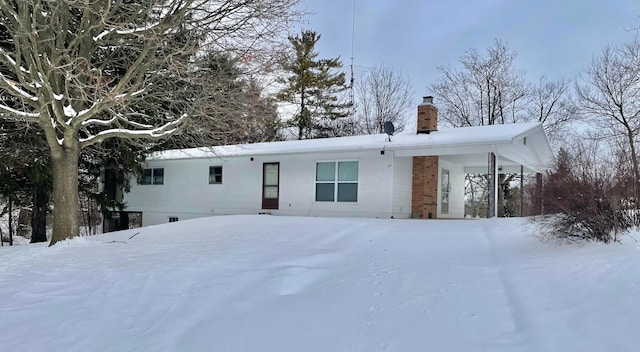 view of snow covered property