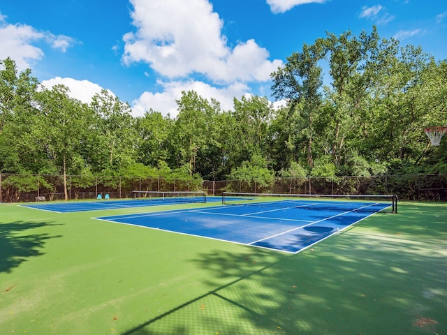 view of tennis court featuring basketball court