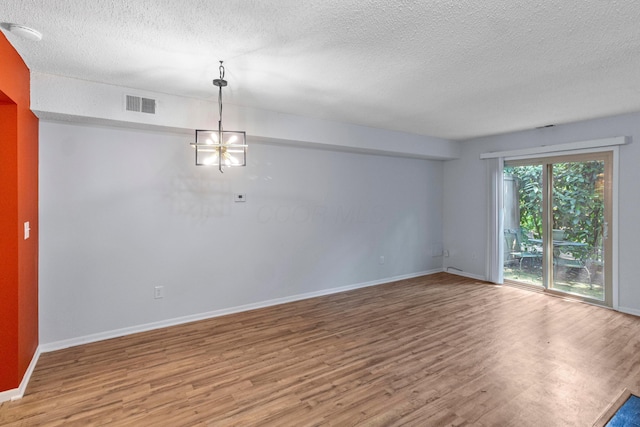 1301 Lake Shore Dr Unit 199, Columbus, OH 43204 - unfurnished room with wood finished floors, a textured ceiling, and a smoke detector