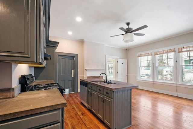 kitchen featuring hardwood / wood-style floors, dishwasher, a kitchen island with sink, sink, and black electric range