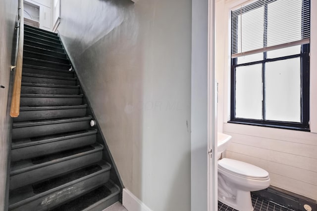 stairway featuring tile patterned floors