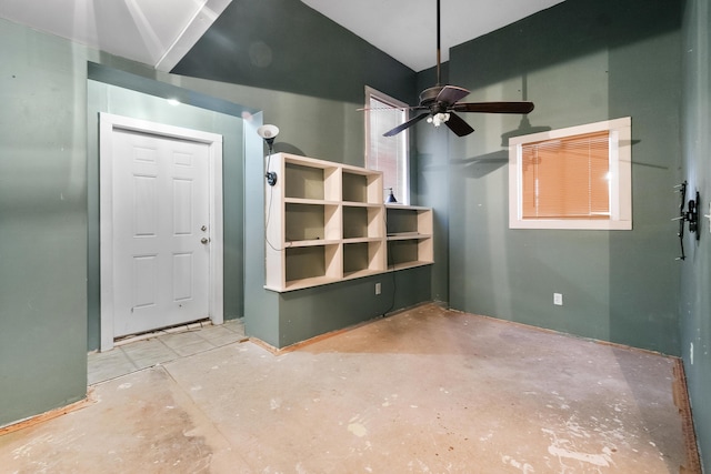 interior space with ceiling fan