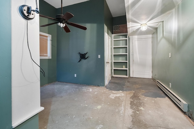 interior space with concrete floors, a baseboard radiator, and ceiling fan