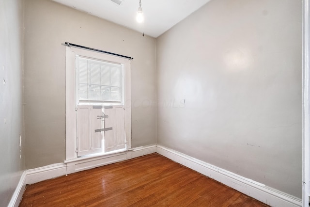 spare room with hardwood / wood-style flooring