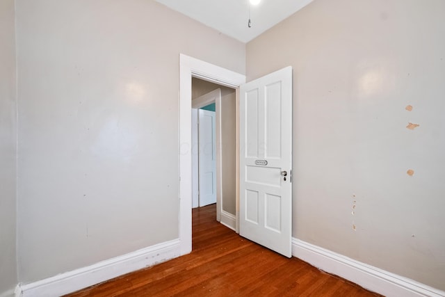 spare room featuring wood-type flooring