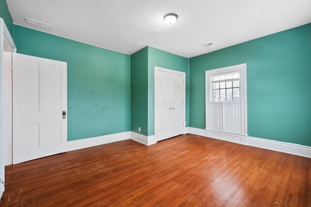 spare room featuring hardwood / wood-style floors