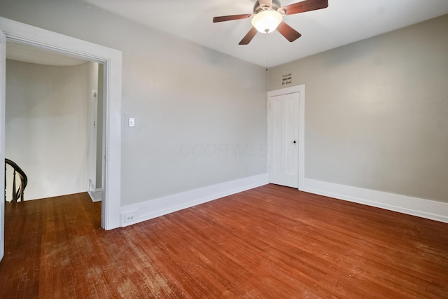 empty room featuring ceiling fan and wood-type flooring