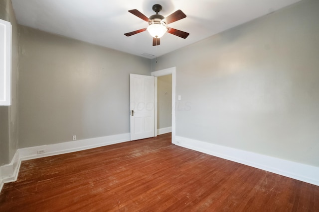 spare room with wood-type flooring and ceiling fan