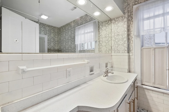 bathroom with vanity and a healthy amount of sunlight