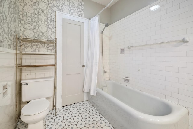 bathroom with shower / bath combination with curtain, toilet, and tile walls