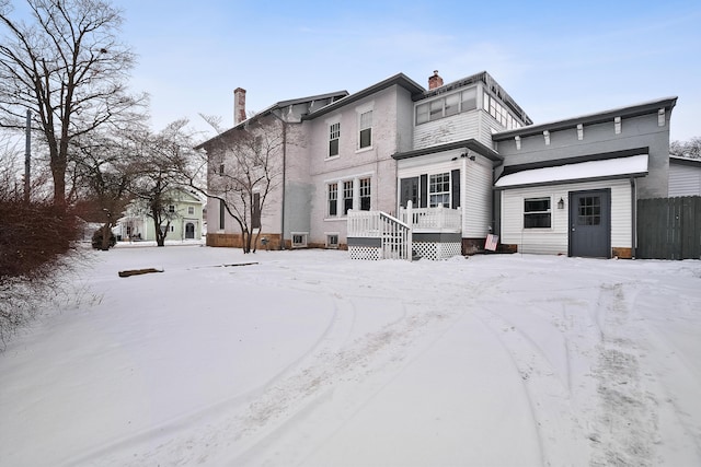 view of snow covered house