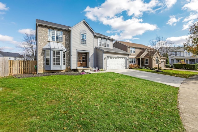 view of front of property featuring a garage and a front lawn