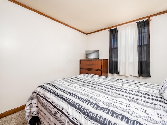 carpeted bedroom with crown molding