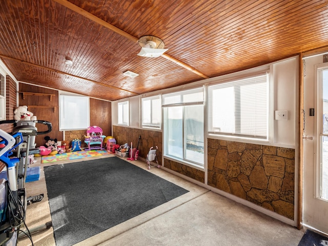 game room featuring wooden walls, wood ceiling, and lofted ceiling