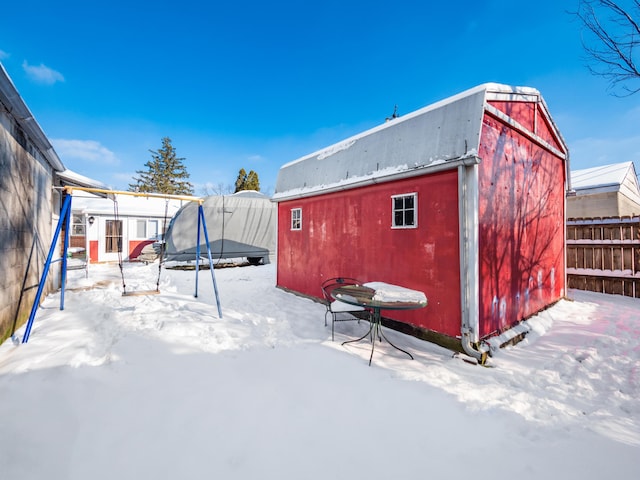 snow covered structure featuring a trampoline