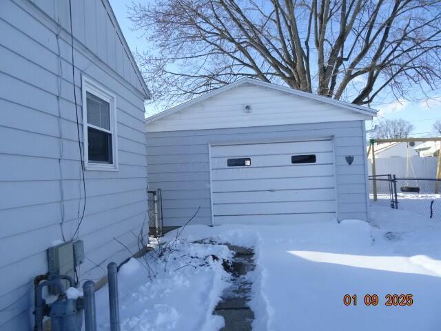 view of snow covered garage