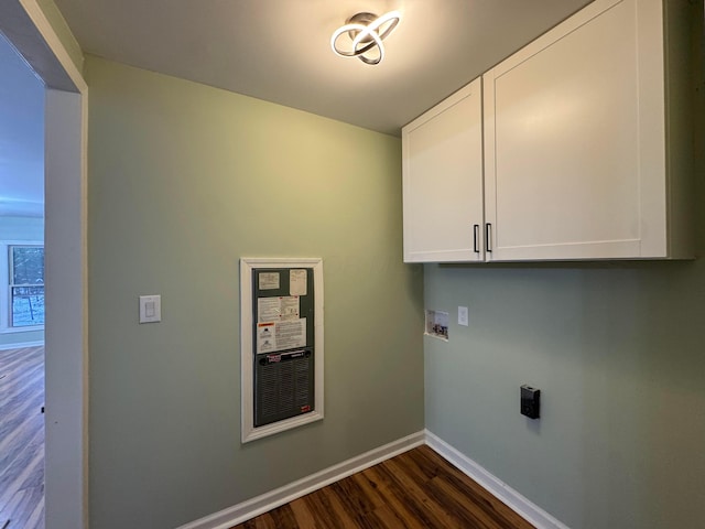 washroom with cabinets, washer hookup, and dark hardwood / wood-style flooring