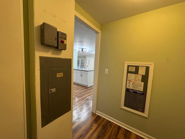 corridor with dark hardwood / wood-style floors