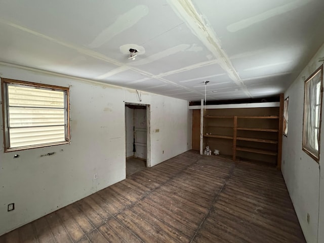 unfurnished room featuring dark hardwood / wood-style flooring