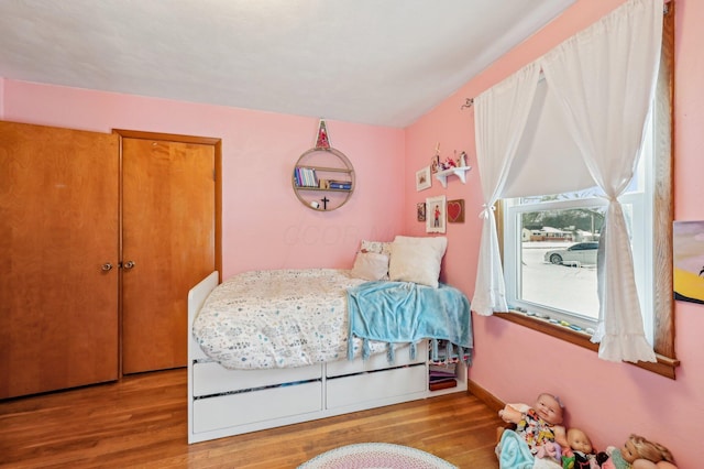 bedroom with light hardwood / wood-style floors