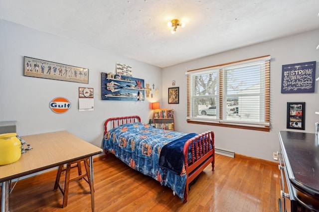 bedroom with hardwood / wood-style floors