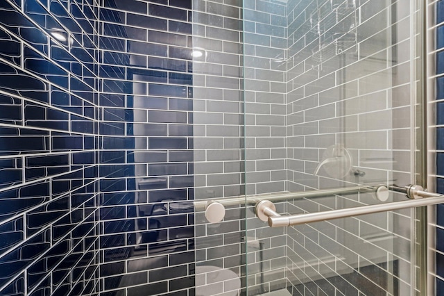 bathroom with tiled shower