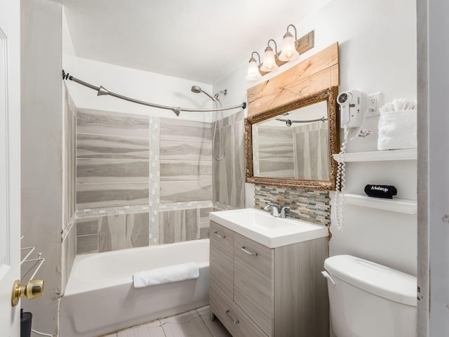 full bathroom with vanity, shower / bath combination, tasteful backsplash, and toilet