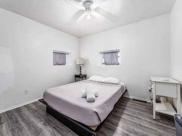 bedroom featuring dark hardwood / wood-style flooring and ceiling fan