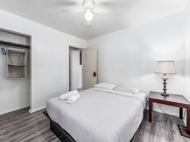 bedroom with ceiling fan and dark wood-type flooring