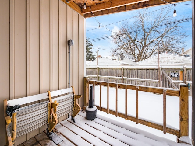 view of snow covered deck