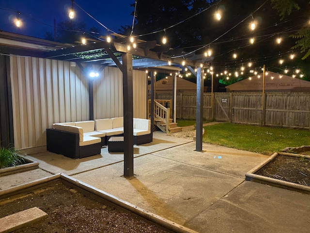 patio at twilight featuring an outdoor living space