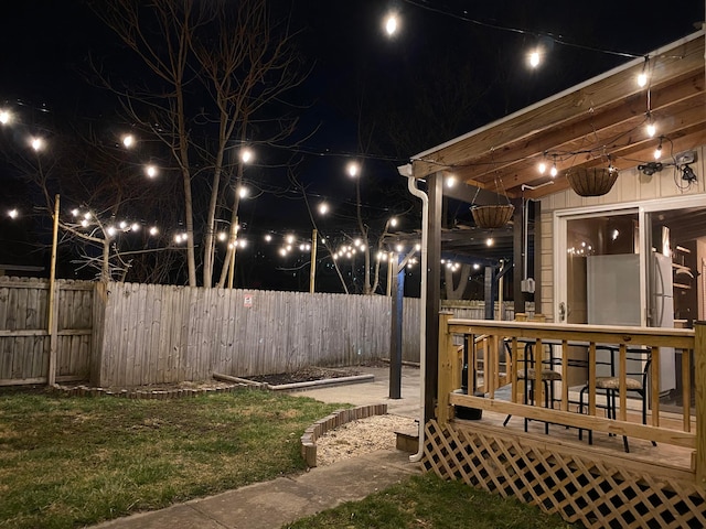 patio at twilight with a deck