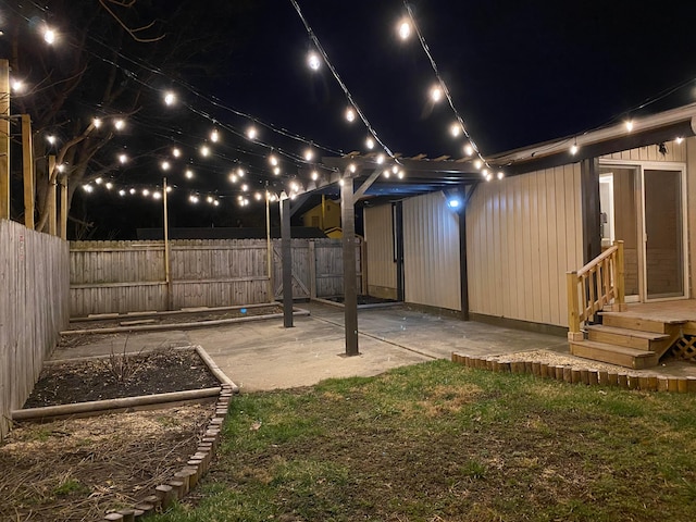 yard at twilight with a patio